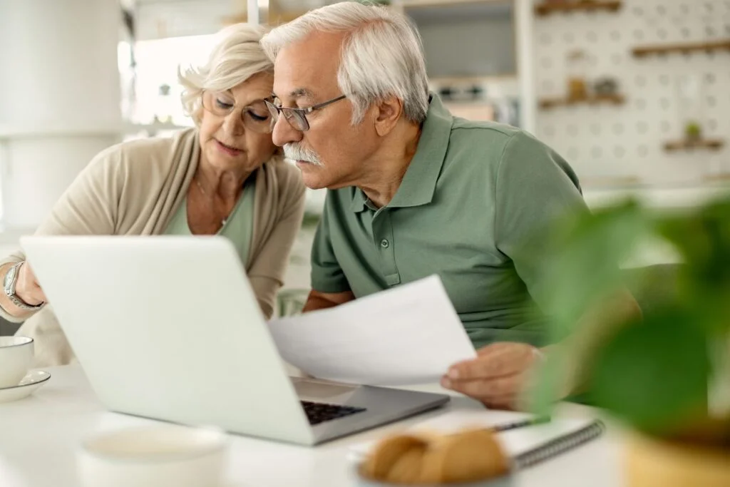 senior couple having research about early access to your super