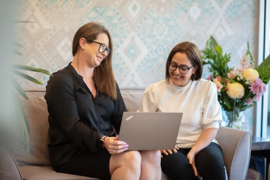 Accountant and a client smiling talking with each other