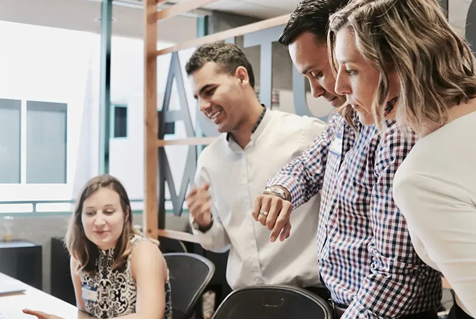 A team of Accountant having a meeting and discussion and looking at the laptop