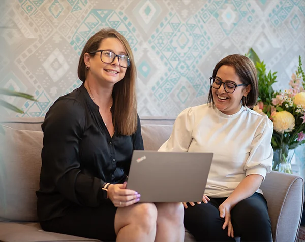 Two Accountant having a happy discussion with a laptop